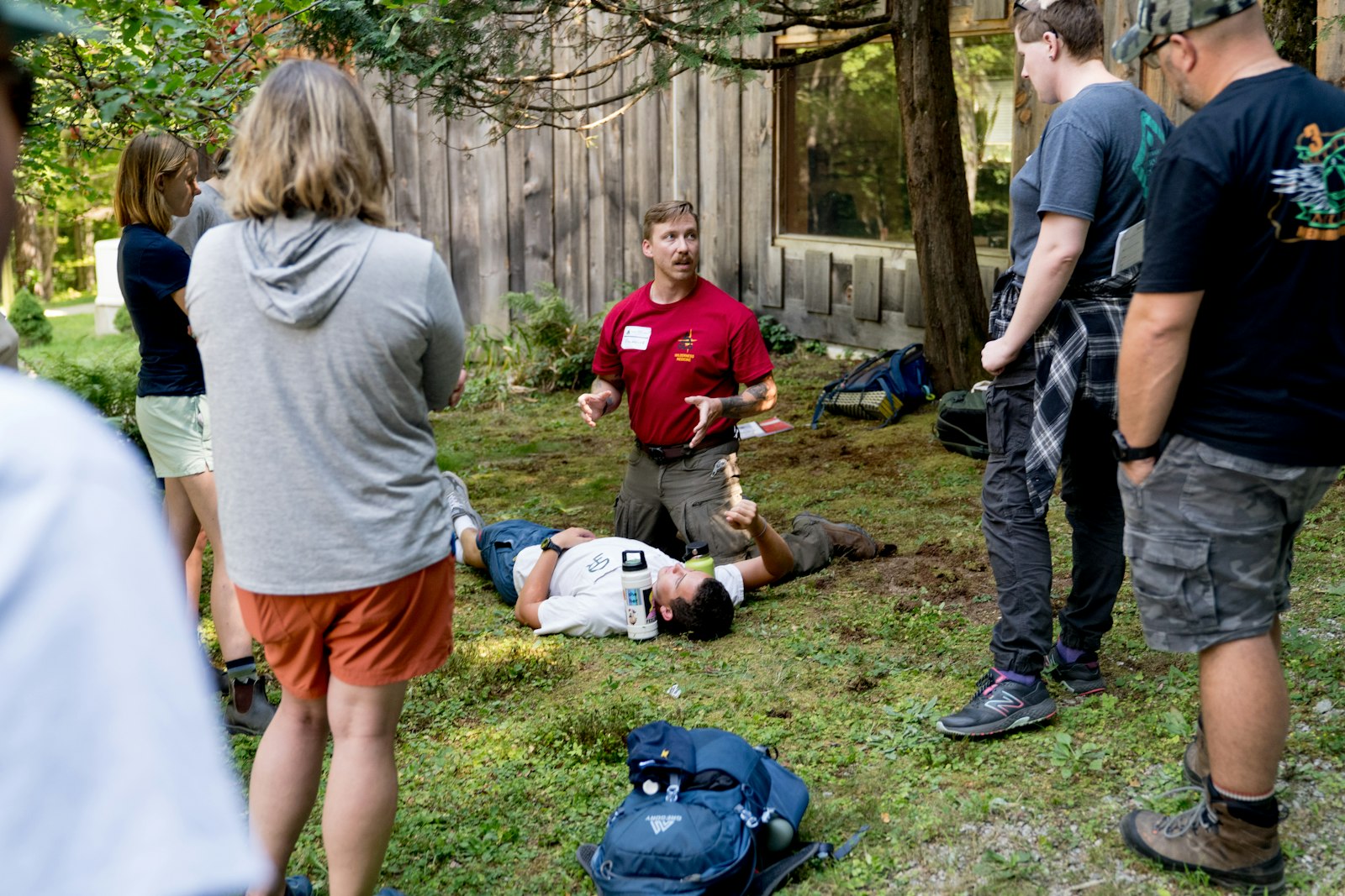 An instructor explaining something to a group in a classroom