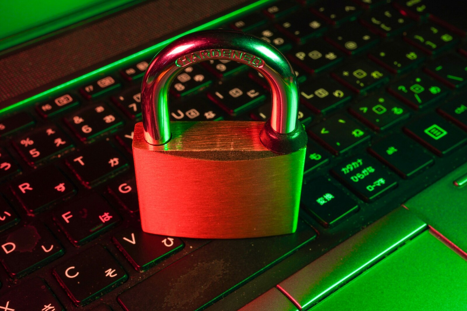 A red padlock resting on a laptop keyboard